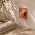 Wall-mounted copper tea light candle holder handmade in the UK