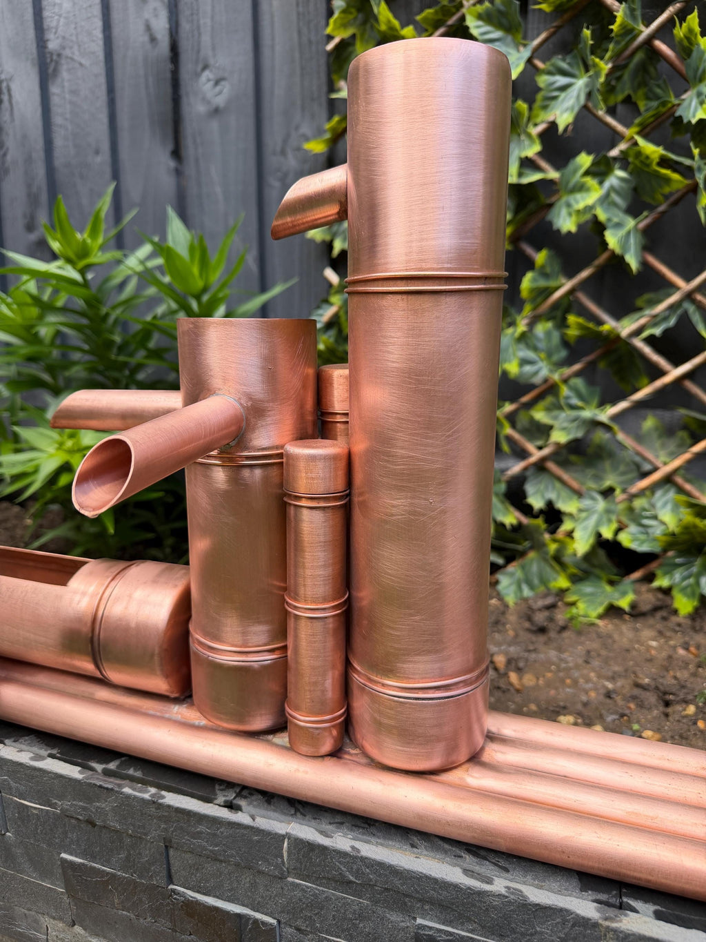 Handcrafted copper bamboo-style garden water feature