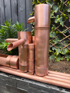 Handcrafted copper bamboo-style garden water feature