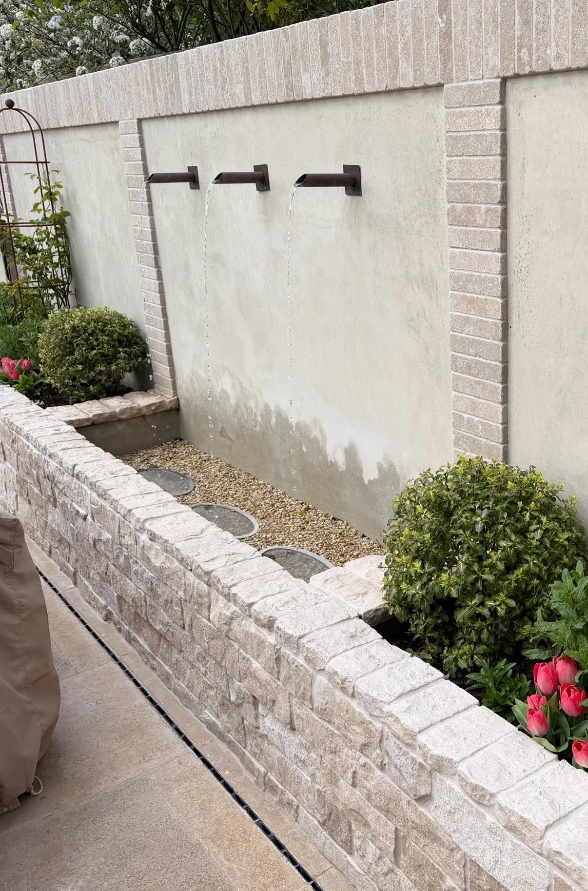 Three copper water spouts for a garden water feature