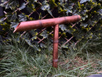 Japanese inspired copper tee water spout in garden setting