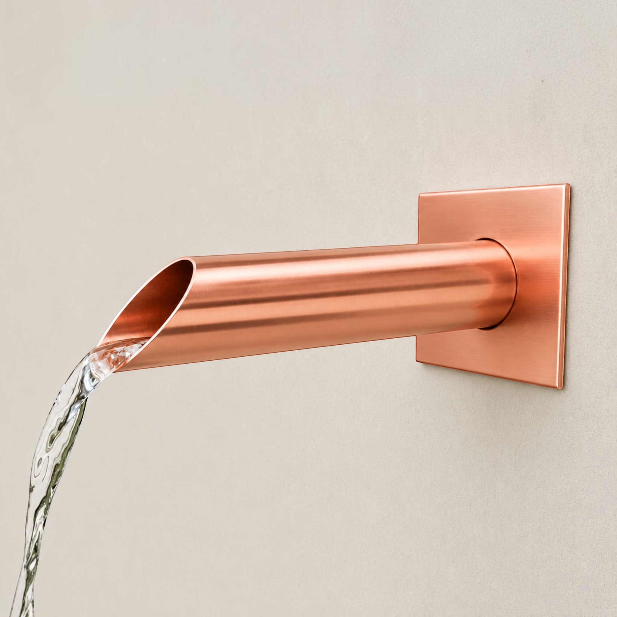 Spoutcraft Studio custom copper water spout, 35mm diameter, with a square wall plate, designed for water features.